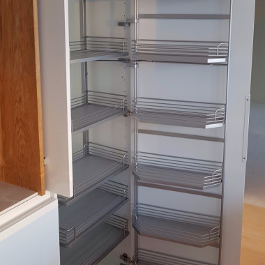 Tandem komeromekanismi